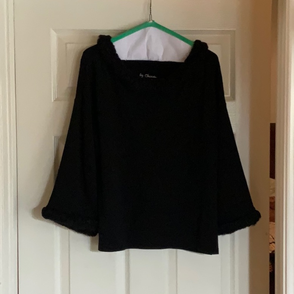 Knit shirt with fun neck and cuffs on sleeves.